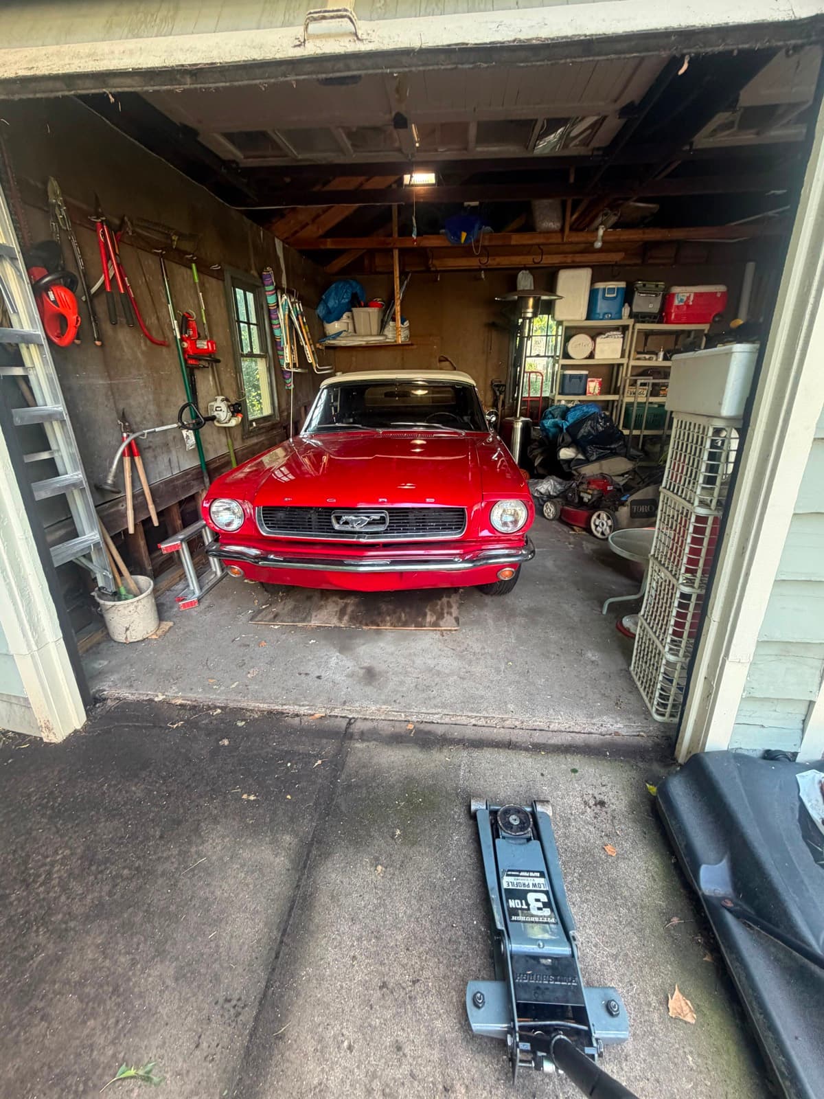 Classic red Ford Mustang in a home garage