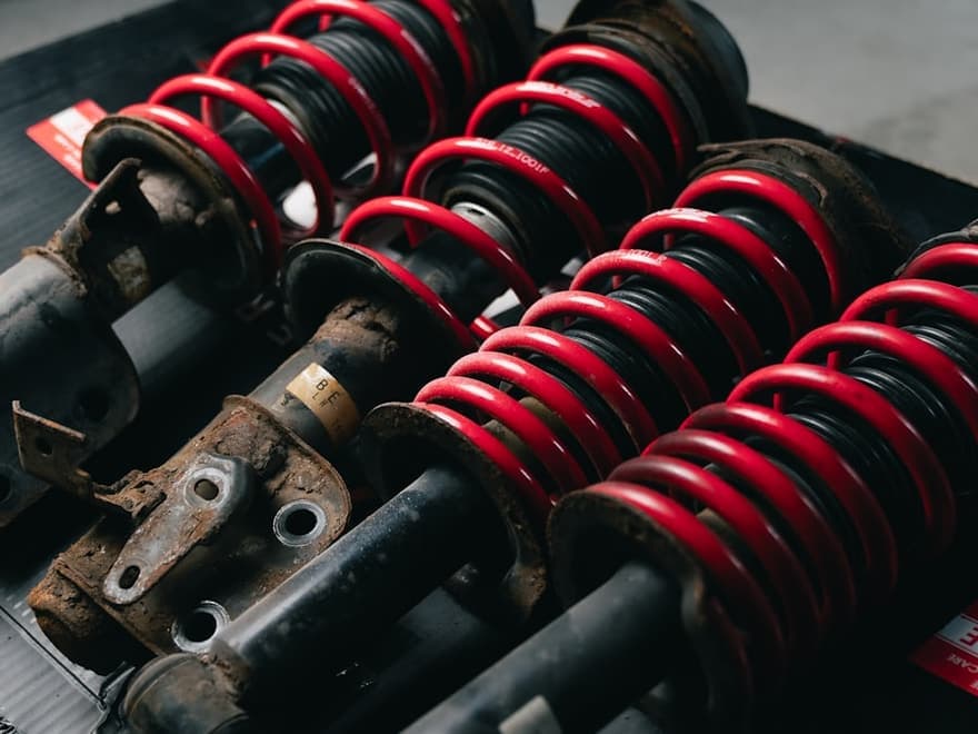 Coil-over shock absorbers and suspension springs